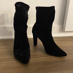 Black velvet sock ankle booties.